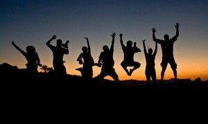Silhouettes of 7 people jumping for joy | Song's Acupuncture & Herbal Clinic